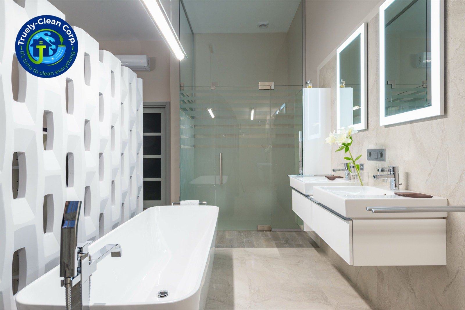 Spotless modern bathroom with freestanding tub, lit mirrors and fresh flowers